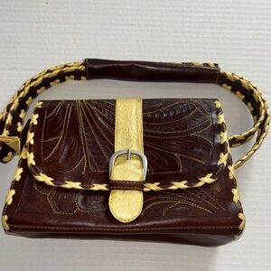 BROWN AND YELLOW  LEATHER HAND BAG DETAILS ARE UNIQUE AND CHIC MADE IN PARAGUAY